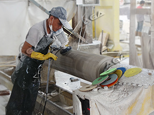 Machine polishing granite column